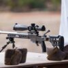 Precision Australian-made rifle shooting gear with scope on a bench for competitive shooting.