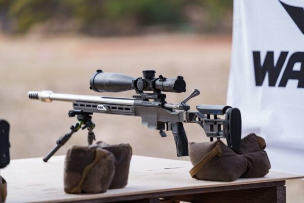 Precision Australian-made rifle shooting gear with scope on a bench for competitive shooting.