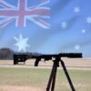 Australian flag overlay on a precision rifle shooting setup outdoors.